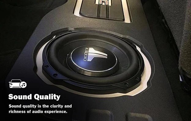 A JL Audio subwoofer installed in a vehicle floor panel, emphasizing high-quality sound performance with a caption describing sound quality as the clarity and richness of audio experience.