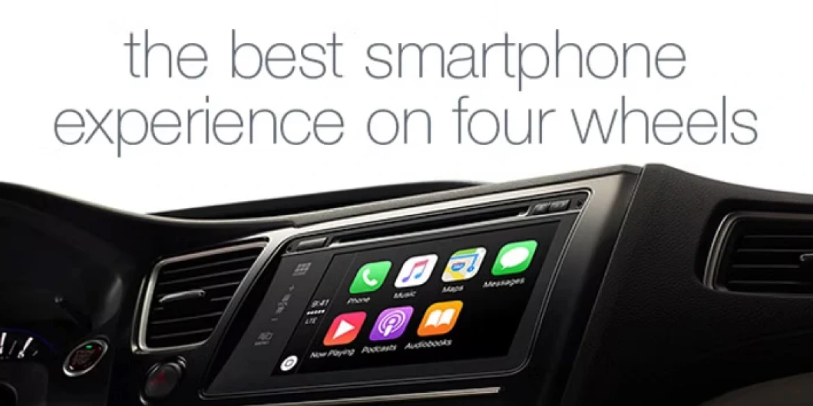 Car dashboard with an infotainment screen displaying smartphone apps like Phone, Music, Maps, and Messages, with the text "the best smartphone experience on four wheels" above.