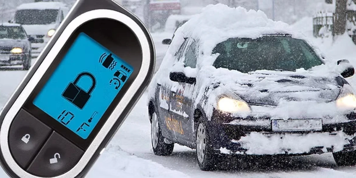 Car remote displaying a locked symbol and a temperature of 10°F is shown in the foreground, with a snow-covered car driving on a snowy road in the background during a winter storm.