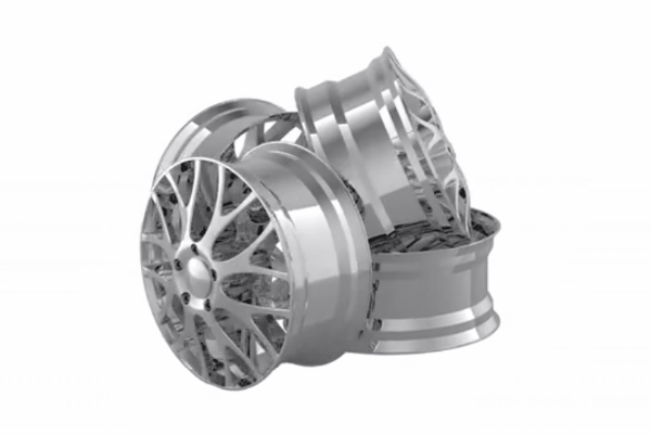 Stack of modern alloy wheels with intricate spoke designs on a white background