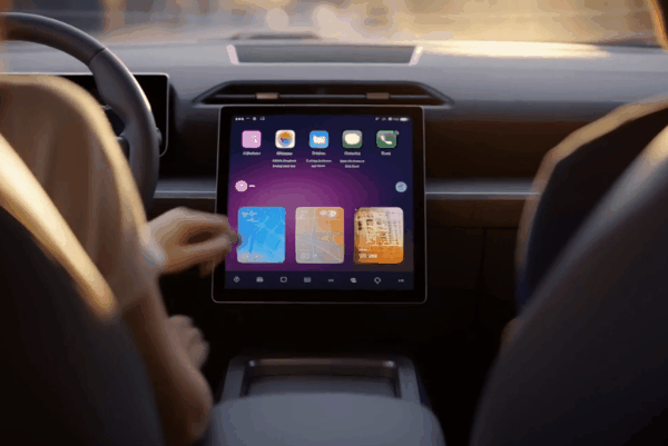 Close-up of a modern vehicle dashboard featuring a square touchscreen display with the Apple CarPlay interface active.