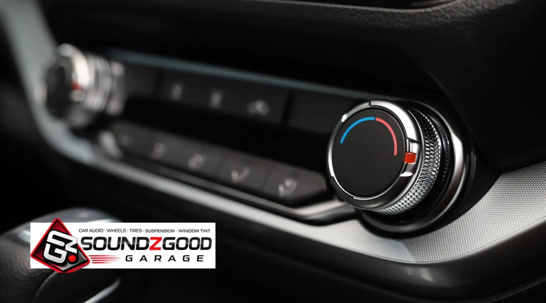 Car dashboard audio control knob representing professional car audio system upgrades by Soundz Good Garage