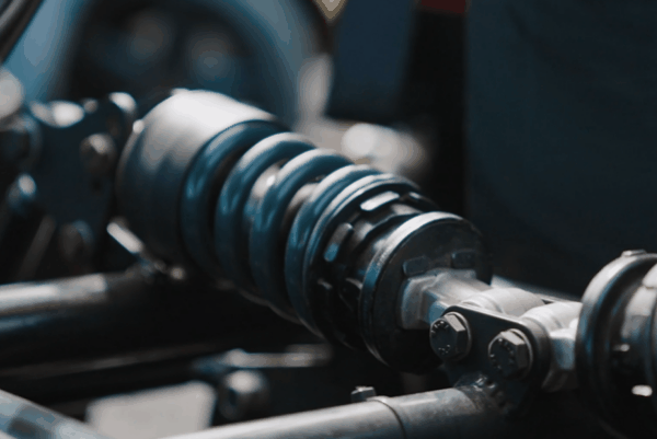 Close-up of a performance coilover suspension component for vehicle handling and stance adjustment